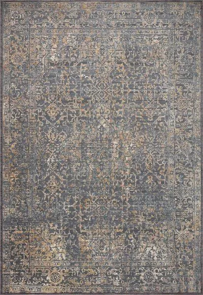 Rectangular contemporary rug in indigo and sunset colors with distressed, intricate faded patterns and varied pile heights