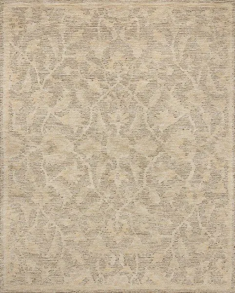 Handmade wool rug with a natural palette featuring ribbed high-low pile and subdued motifs in background base