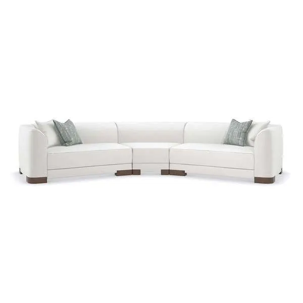 Curved lounge sectional sofa in white chenille with rounded edges and exposed French Roast wood feet