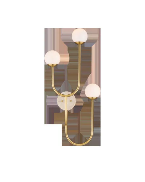 Highsmith Wall Sconce with three milk glass globes at varying heights on brass-finished metal stems and a travertine wall ...