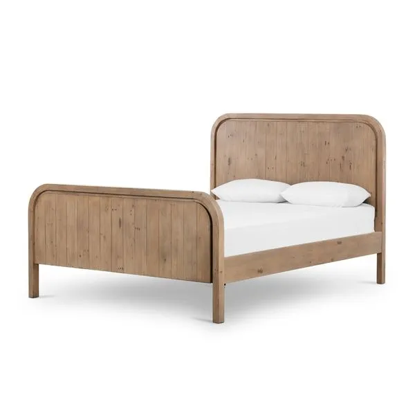 Queen bed made from mixed reclaimed wood with curved headboard and footboard in natural finish