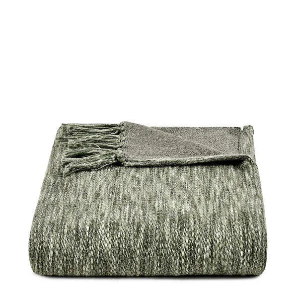 Folded handwoven throw blanket in natural gray with fringed ends and soft textured cotton weave