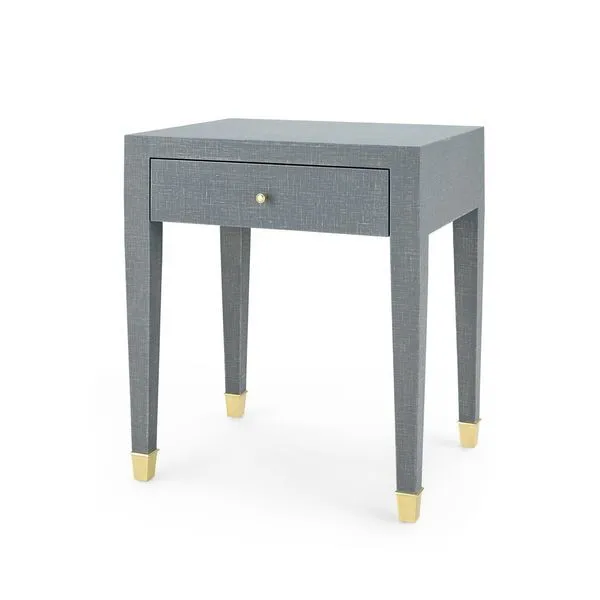 Claudette 1-Drawer Side Table in washed lacquered linen with tapered legs and brass-capped feet