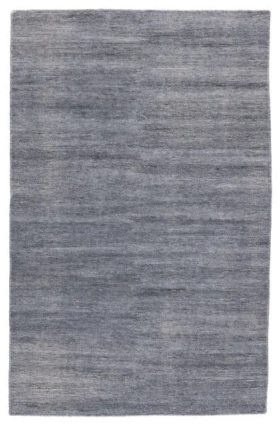 Rectangular solid gray-blue indoor/outdoor rug with a subtle distressed texture and muted color variation