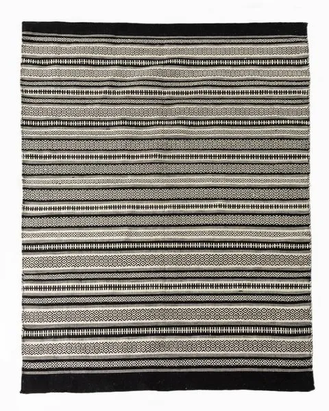 Black and white outdoor rug with graphic horizontal stripe and diamond pattern in 9x12 size made from recycled materials