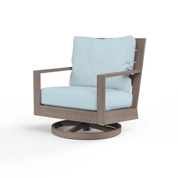 Laguna Swivel Club Rocker with hand-brushed aluminum frame mimicking driftwood and light blue seat and back cushions