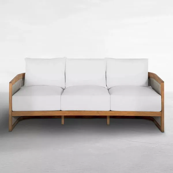 Avalon Teak Sofa shown at a three-quarter angle highlighting its curved armrests and flush cushion edges