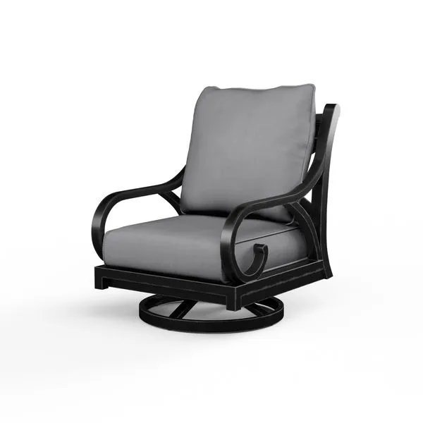 Outdoor swivel rocker chair with curled arms, cross back detail, aluminum frame in espresso finish, and gray cushions