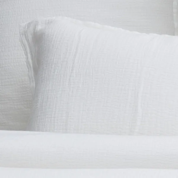 Waverly Duvet Set in white with wavy pebbled texture, ½” flange, shell button closure, and envelope shams