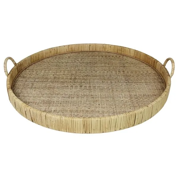 Large round woven rattan tray with raised edges and two loop handles on wood frame