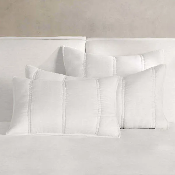 Cloud white rectangular pillow shams with large channel quilted stitching and soft textured ramie fabric
