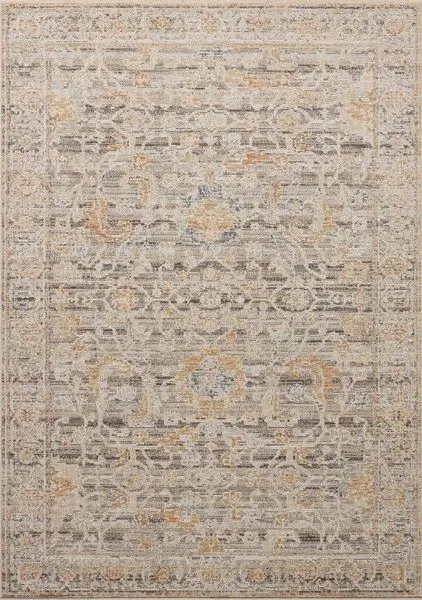 Vintage style area rug with distressed charcoal and apricot motifs in neutral grey and beige tones