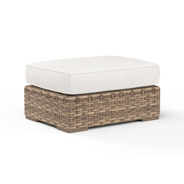 Havana Ottoman with aged tobacco all-weather wicker base and thick off-white cushion top