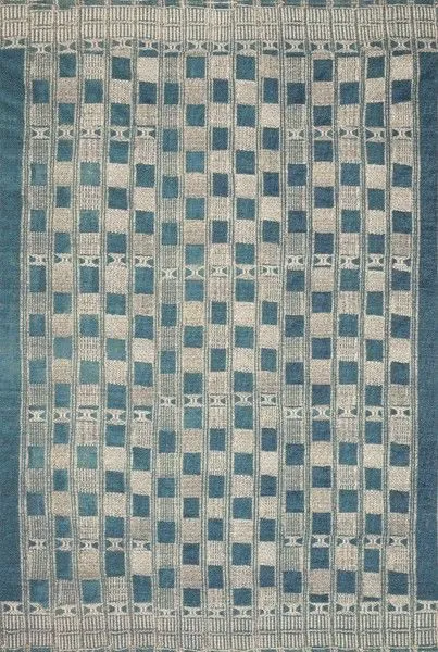 rectangular blue and ivory rug featuring an abstract tribal checkered and geometric pattern with textured yarn