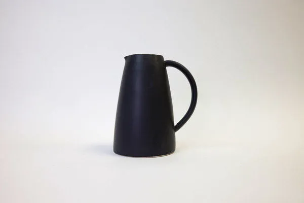 Thomas Black Garden Pitcher in matte black ceramic with narrow spout and curved handle