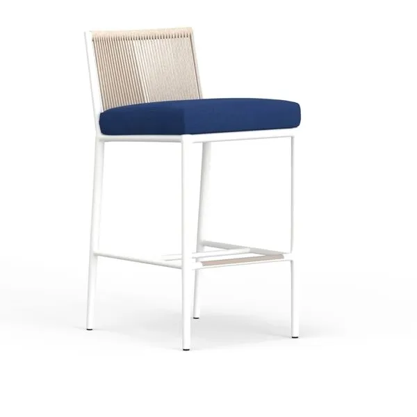 Sabbia Barstool with satin white aluminum frame, natural-colored all-weather rope back, and blue cushioned seat
