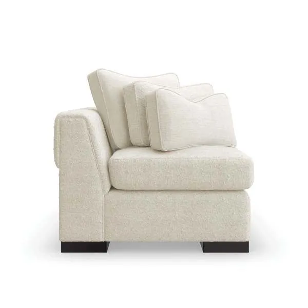Edge Loveseat in light beige with channel quilting around back and arms, layered cushions, and dark satin ebony legs