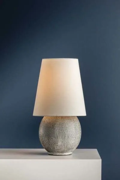 Ulsterville table lamp with oversized linen shade and textured spherical ceramic base in neutral tones
