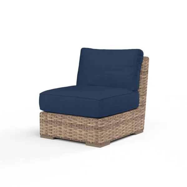 Havana Armless Club Chair with aged tobacco all-weather wicker frame and deep navy blue cushions