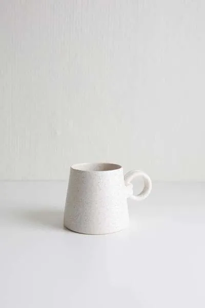 White ceramic Jerry Double Wrap Handle Mug with speckled texture and unique double wrap handle design