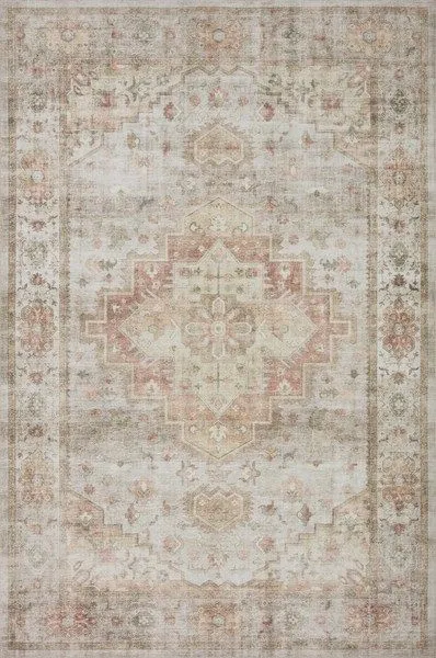Vintage style rug with old-world medallions in soft beige, sage, and muted rust tones with a distressed look