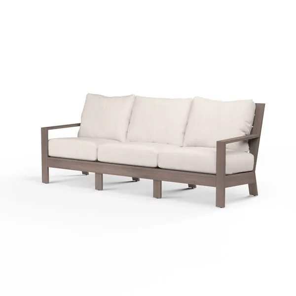 Laguna Sofa with aluminum frame finished to mimic driftwood and plush off-white cushions