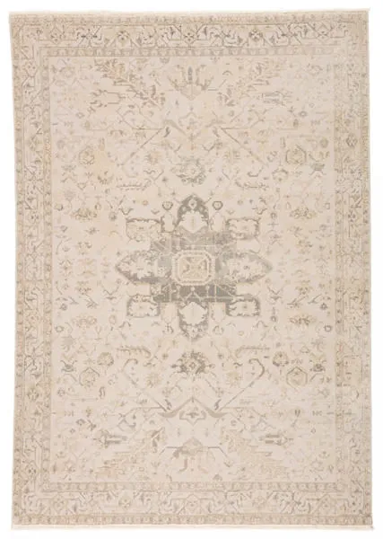 Lucien Medallion rug in cream and light gray with distressed medallion and metallic silver and gold accents