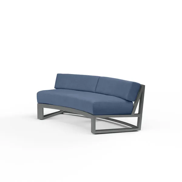 Redondo Curved Sofa with low back, blue cushions, and brushed slate powder coated aluminum frame