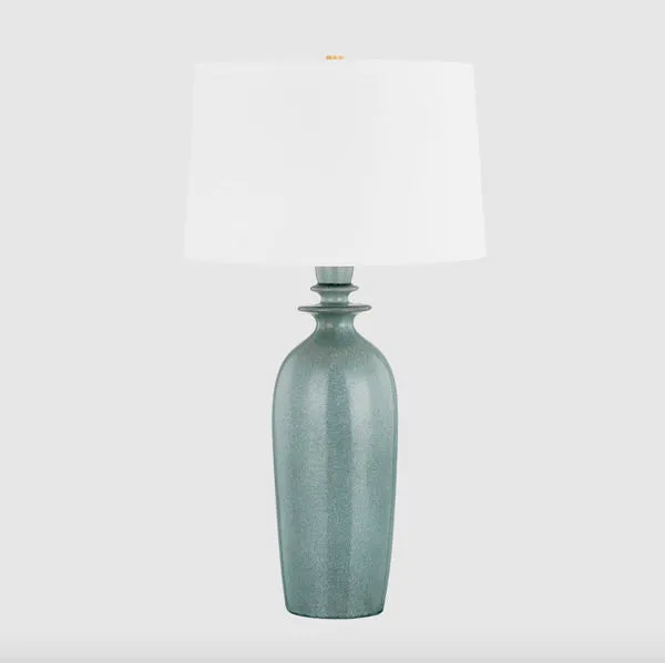 Bellmawr Table Lamp against light grey background on plain surface, full lamp with wide white drum shade