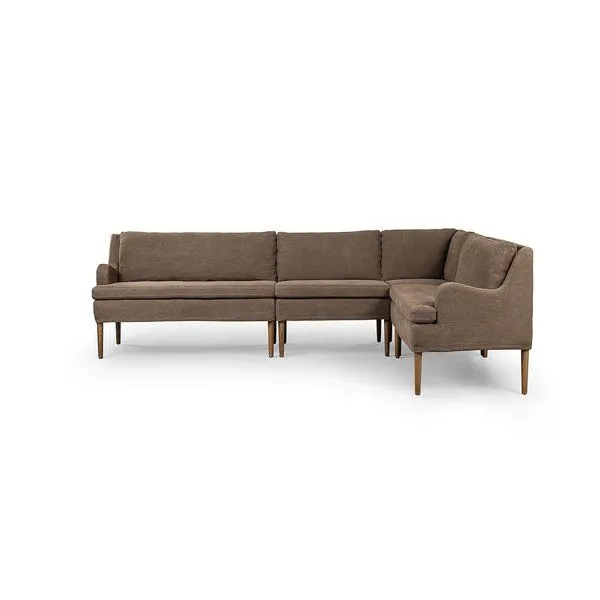 L-shape dining banquette with sloping track arms, tapered wooden legs, and 100% linen upholstery in warm brown.