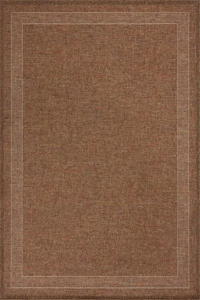 Rectangular indoor/outdoor rug in cinnamon rust with a clean-lined two-border pattern