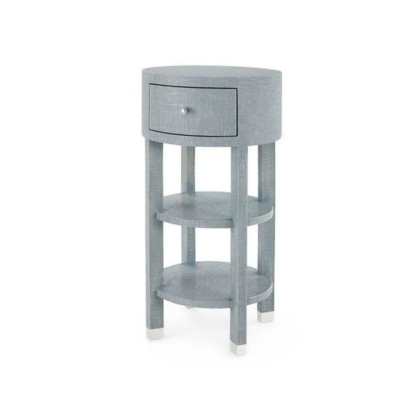 Claudette 1-Drawer Round Side Table with washed lacquered linen finish on modern structured form with round top and two sh...