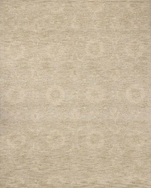 Hand-tufted wool area rug in natural hues with ribbed high-low pile and subtle circular motifs