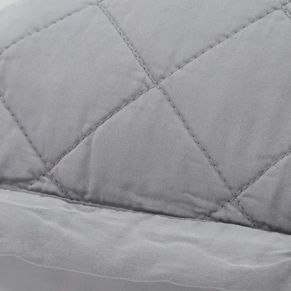 Close-up of diamond quilted texture and smooth bamboo sateen fabric details on Monaco coverlet