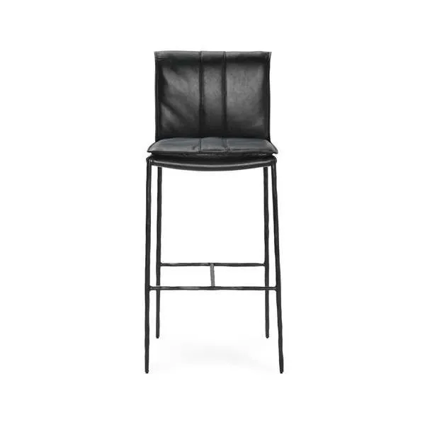 Mayer Stool with thin iron legs and black leather seat featuring rolled back and decorative stitching