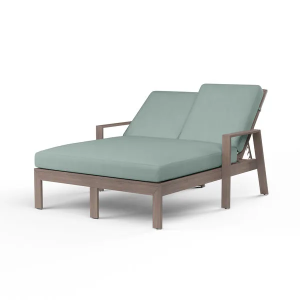 Laguna Double Chaise Lounge with hand-brushed aluminum frame mimicking driftwood and pale blue cushions for two