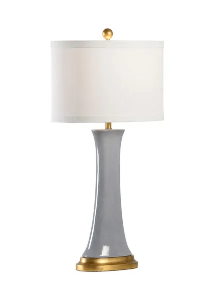 Table lamp with mottled gray glazed ceramic body, antique gold leafed wood base, brass parts, and white drum shade