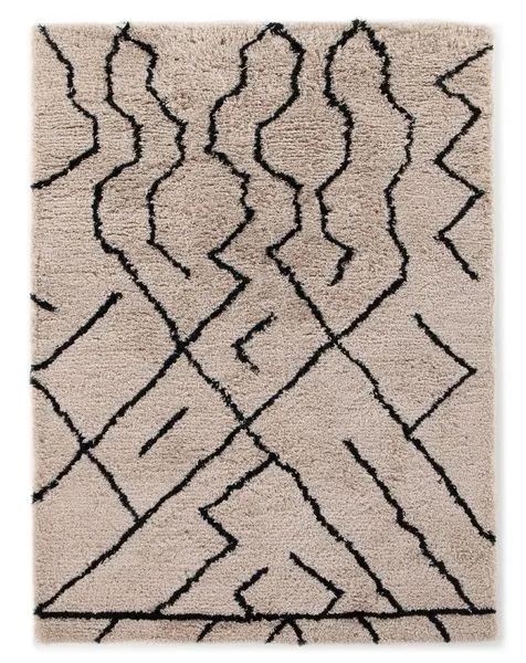 Beige shag outdoor rug with black geometric Beni-style Moroccan pattern, soft textured pile