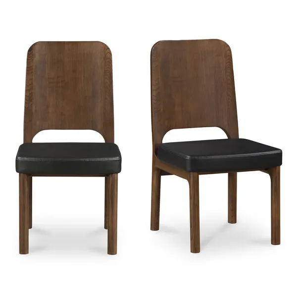 Pair of Kerr dining chairs with high walnut-stained backs and black padded vegan leather seats