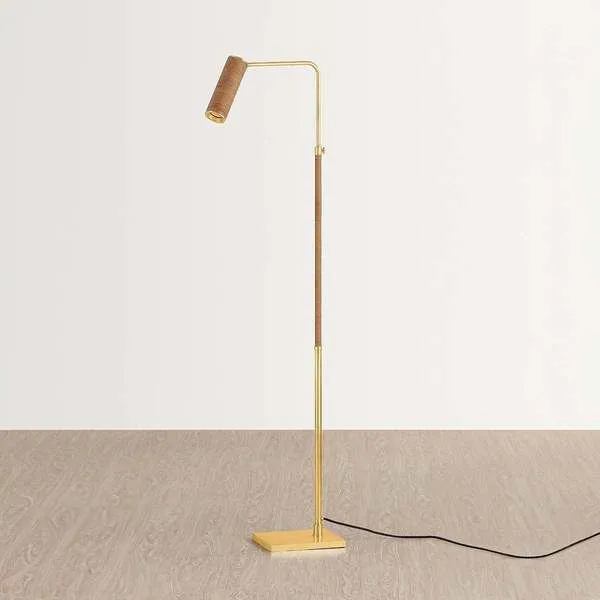 Narragansett floor lamp with aged brass frame, rattan-wrapped midsection and cylindrical rattan shade on elongated swing arm