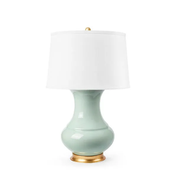 Front view of Thiri Lamp with white drum shade and gold finial against a white background