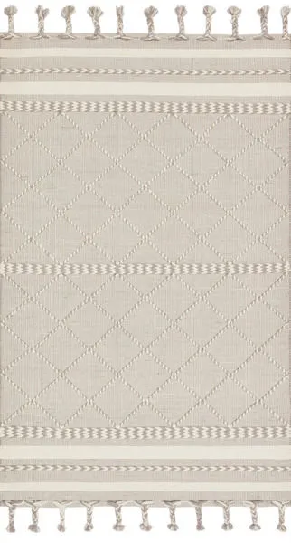 Sawyer Silver Rug with light grey and cream tones, diamond pattern, and braided fringe ends