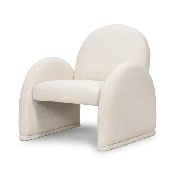 Cream upholstered accent chair with a rounded back and broad, curved armrests extending to the floor
