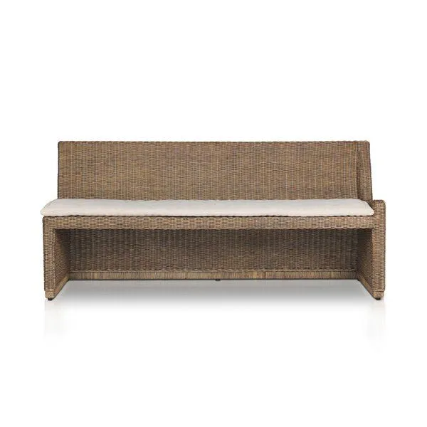 Senna Woven Dining Bench in natural rattan with soft curved frame and a beige fabric cushion