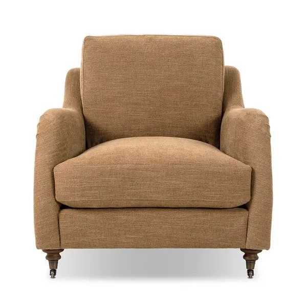 Lynne chair in warm brown fabric with rolled arms, sink-in cushions, turned wood legs with casters
