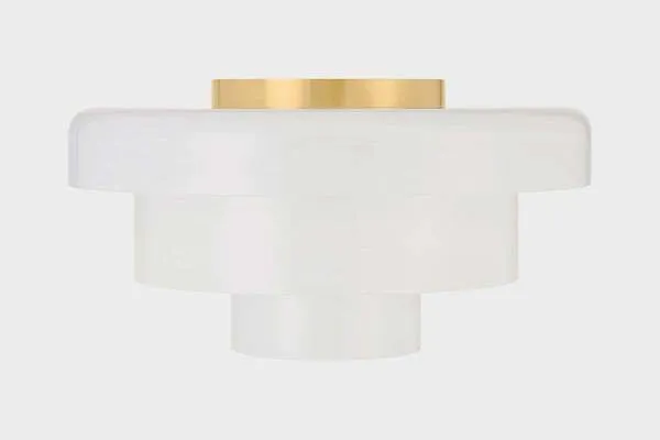 Side view of flush mount highlighting the brass mounting plate atop concentric white glass shades