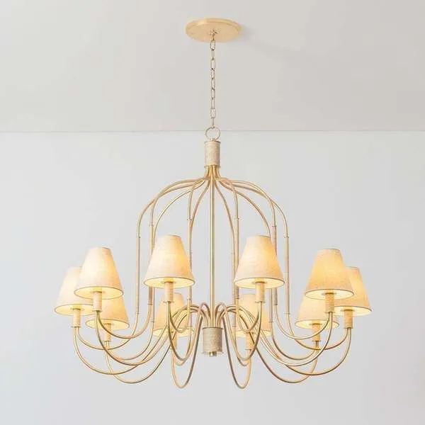 Warrensburg Chandelier with swooping vintage gold leaf metal arms and linen fabric shades, featuring abaca-wrapped details.