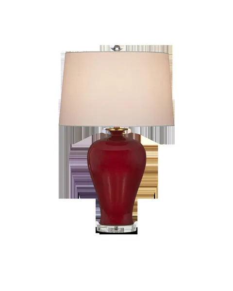 Imperial Red Table Lamp with deep red ceramic base, clear round acrylic pedestal, and cream tapered drum shade