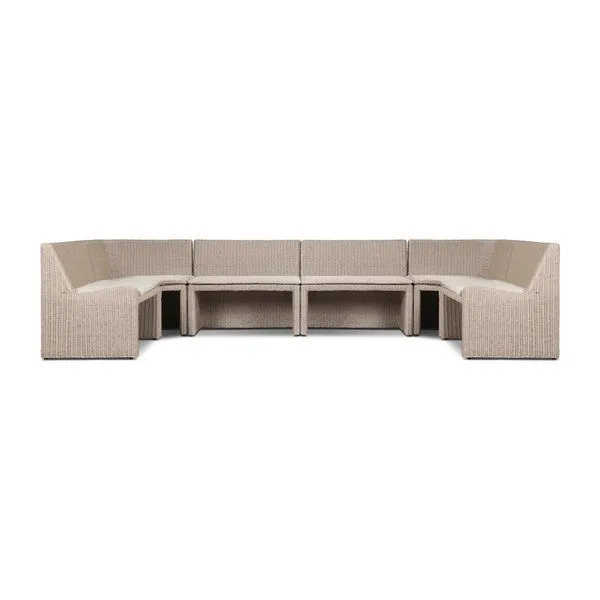 U-shaped vintage white outdoor dining banquette with rattan frame and fabric seat cushions