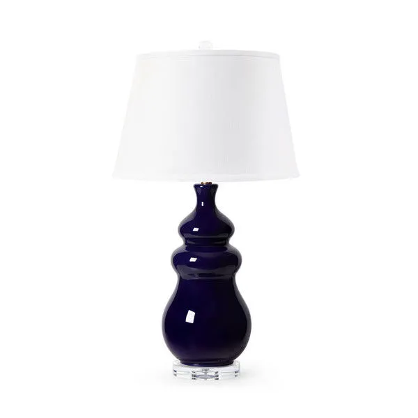 Table lamp with mako blue glazed ceramic base in a balanced, tailored form topped by a white fabric shade